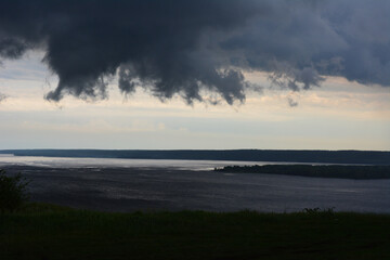 Dramatic River Landscape Under Storm Clouds wallpaper