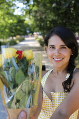 Hispanic woman getting some flowers 