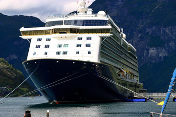 a cruise ship moored in a fjord in Norway