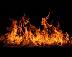 Fototapeta premium Realistic flames and fiery textures on a black background.