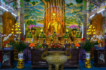 Golden Buddha Altar with Offerings and Floral Decorations at Linh Phuoc Pagoda, Da Lat, Vietnam