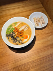 A bowl of delicious Japanese style chicken ramen taken with phone camera, ramen bar