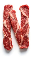 Letter N laid out with pieces of meat on a white background. 