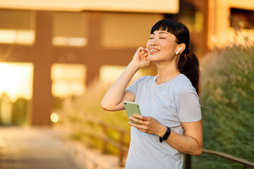 Portrait of a young beautiful sport woman smiling happy and confident. Standing and  doing exercise...