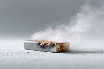 Failing battery emitting smoke, a symbol of malfunction, burnout, or end of life. Great for concepts around technology failure, risks, or product defects. Clean, modern look.