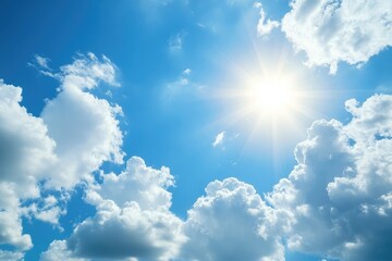 Bright sun, puffy clouds in a vast blue sky