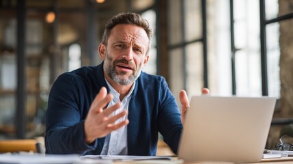 Mature business man executive coach talking using laptop computer having video conference call virtual meeting, professional training negotiation remote working doing online presentation in office., 