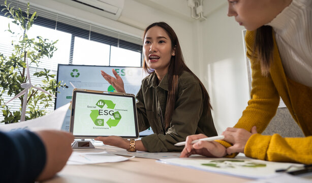 Asian business leaders meet to strategize on implementing sustainable practices, focusing on reuse, recycling, and environmental protection for a greener future