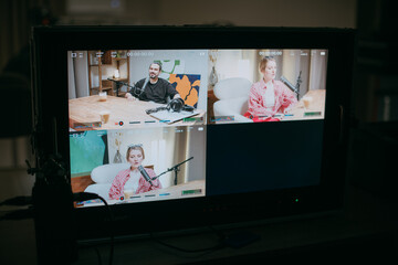 Video podcast recording studio. A conversation between a man and a woman sitting in front of...