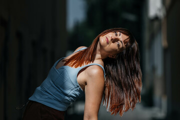 Young caucasian female posing outdoors with long hair