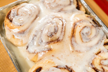 Freshly Baked Cinnamon Rolls Cooling on Stove Top