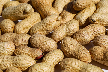 Close up image of bulk peanuts 