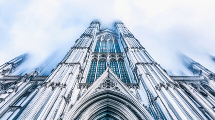 Gothic cathedral with intricate architecture. Tall spires reach into a cloudy sky. The scene evokes a mystical and esoteric atmosphere, perfect for Halloween themes.