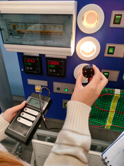 Water supply system control panel with switches and indicators. The engineer controls the process.