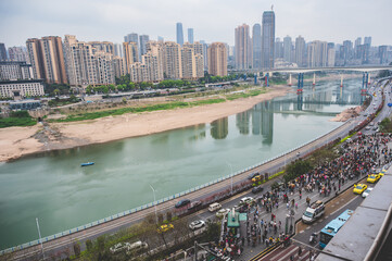 Chongqing.china 27.03.2024 Crowds Gather in the Bustling City of Chongqing, Waiting to Witness the Famous Train Passing Through the Building
