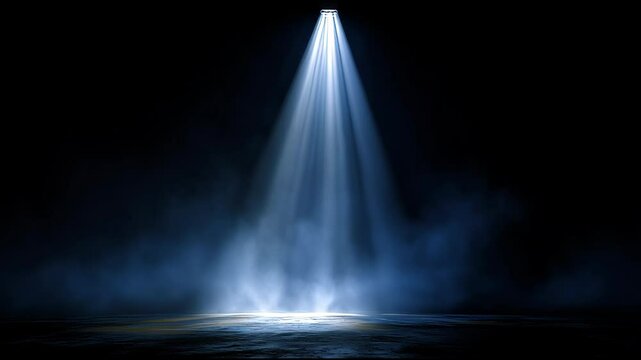 A powerful spotlight cuts through deep darkness, illuminating the ground below. The focused beam brings a dramatic feel to the otherwise empty area, creating a sense of suspense and intrigue