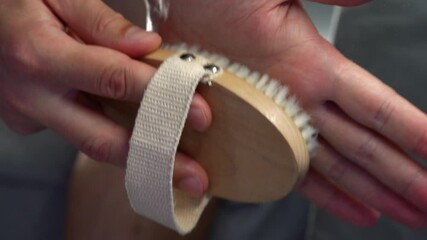 Treating Kodi with Dry Brushing Massage.
Close-up of a Skin Massage Brush.
Skin Health and Body Cleansing.
Healthy Shower Treatments