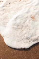 sand on the beach with bubbles