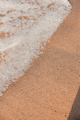 sand beach with bubbles and water