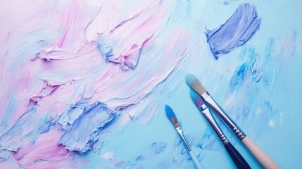 Fototapeta premium background of voluminous strokes of paint and different shades, easy transitions from one shade and color to another, brushes and spatulas lie in the lower right corner