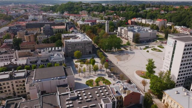 Aerial view of Kaunas city center, Lithuania. The camera is moving slowly above the city, showing the architecture and streets around Unity Square