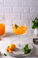 Fresh apricot Bellini cocktail with mint