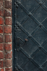 Weathered Wrought Iron Door and Brick Wall