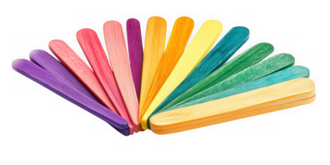 A fan arrangement of colorful wooden craft sticks on a plain black background view on transparent background