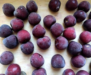 plums on a white background