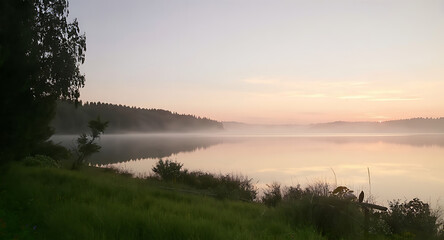 Sunrise over Misty Lake with Shoreline Vegetation