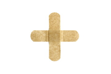 On a white isolated background there is an adhesive plaster in the form of a cross.