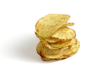 Potato chips are stacked on top of each other on a white background.