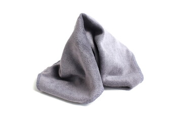 A crumpled grey napkin lies on a white background.