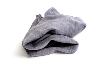 A crumpled grey napkin lies on a white background.