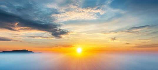 Golden Sunrise Above a Misty Foggy Surface, Illuminating Cloudy Skies Over Serene Mountains