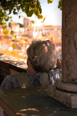 Fototapeta premium little boy looking out of the window