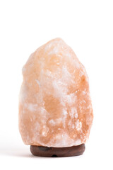 Pink salt lamp on white background.