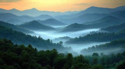 Misty mountain range at sunrise.