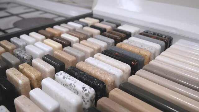 A sample of natural or artificial stone for kitchen countertops and other furniture. Stone texture for modern interior design