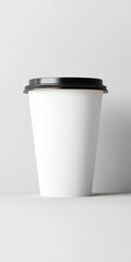 Close-Up Mockup of a Simple White Disposable Coffee Cup with Black Plastic Lid on Minimal Background