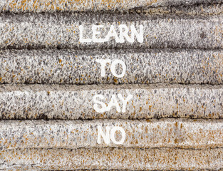 Learn to say no symbol. Concept words phrase Learn to say no on beautiful grey stone wall. Beautiful stone wall background. Business psychological Learn to say no concept. Copy space.