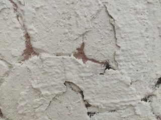 Cracked white stucco wall texture for rustic architectural backgrounds and weathered design elements