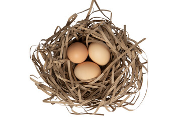Three brown eggs in paper nest – top view,  isolated on transparent background, PNG