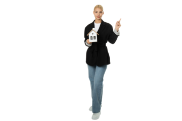 Woman holding house model and pointing – isolated on transparent background, PNG, front view