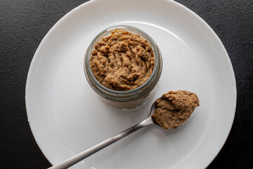 Fresh homemade veal liver pate, chicken pate on a white plate. Delicious homemade food. Options for a buffet.