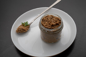 Fresh homemade veal liver pate, chicken pate on a white plate. Delicious homemade food. Options for a buffet.