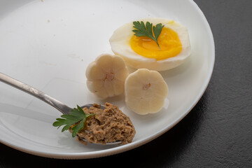 Fresh homemade veal liver pate, chicken pate on a white plate. Delicious homemade food. Options for a buffet.