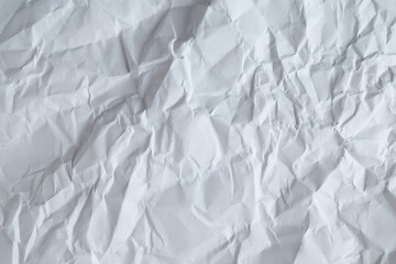 Obraz premium Wrinkled white sheet of paper background texture 