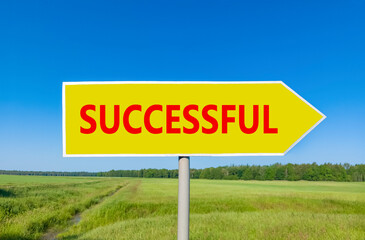 Successful symbol. Concept word Successful on beautiful yellow road sign. Beautiful blue sky green grass and forest peaceful nature background. Business successful concept. Copy space.