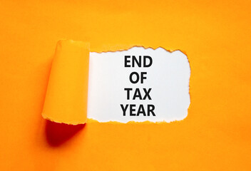 End of tax year symbol. Concept words phrase End of tax year on beautiful white paper. Beautiful...